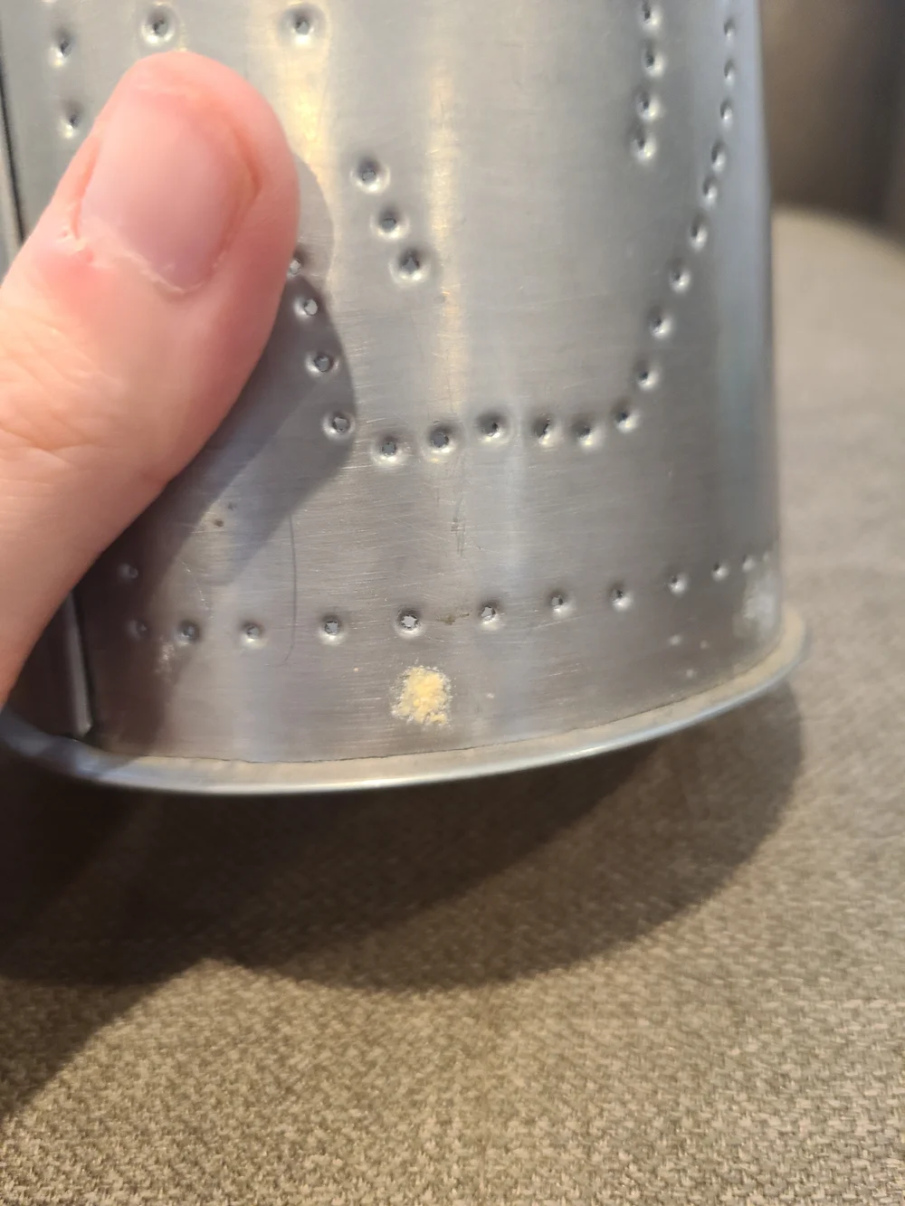 Primitive Irvin's Punched Tin Lamp featuring a distinct apple